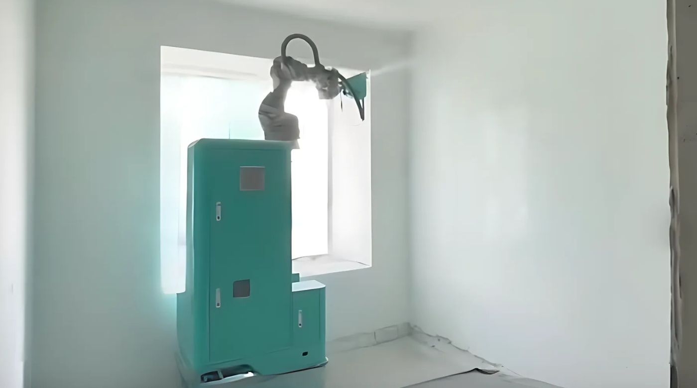 The spray painting robot is performing automated painting work inside the unit